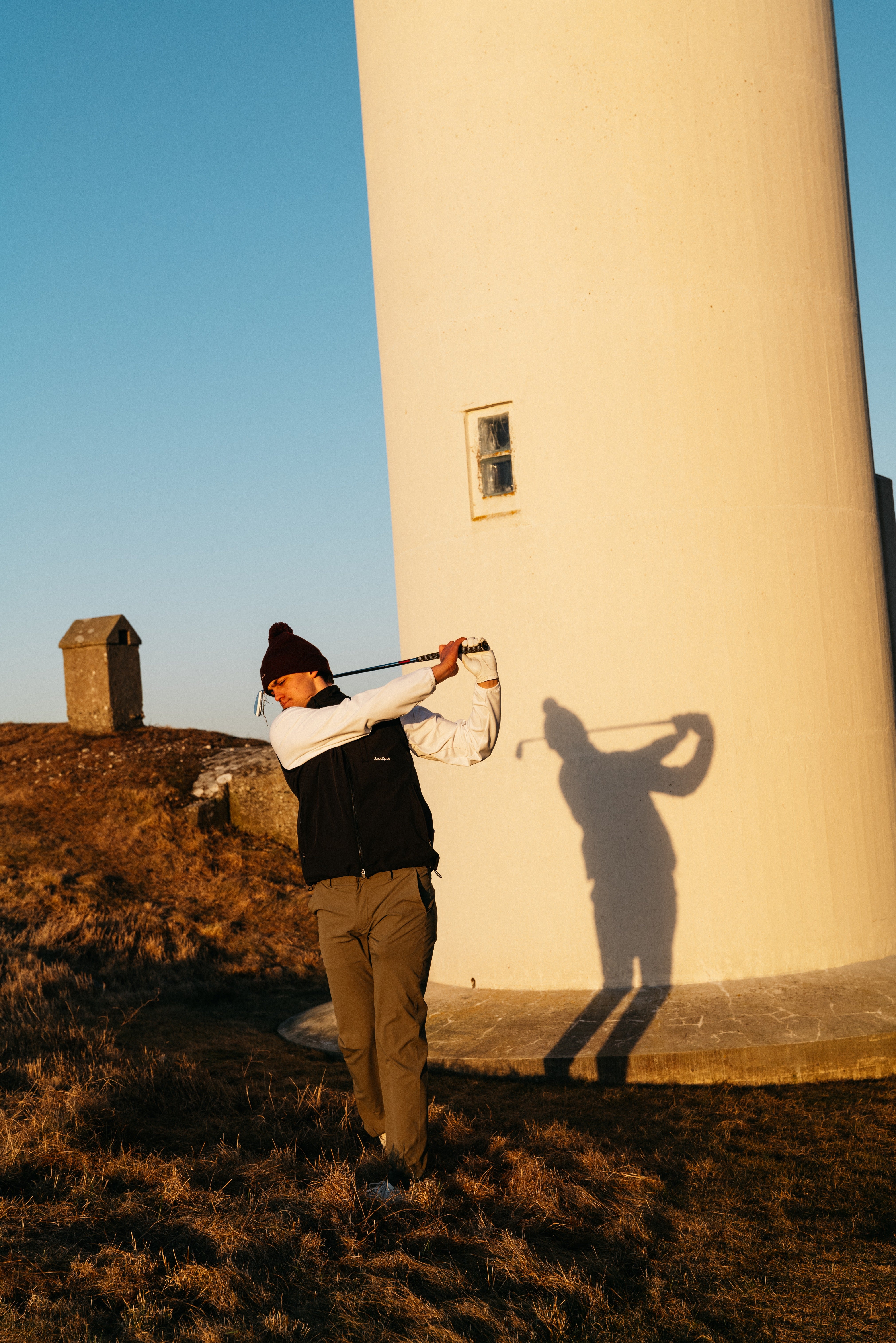 Historic Scottish golf course with players in traditional attire, reflecting when was golf invented and the sport’s origins